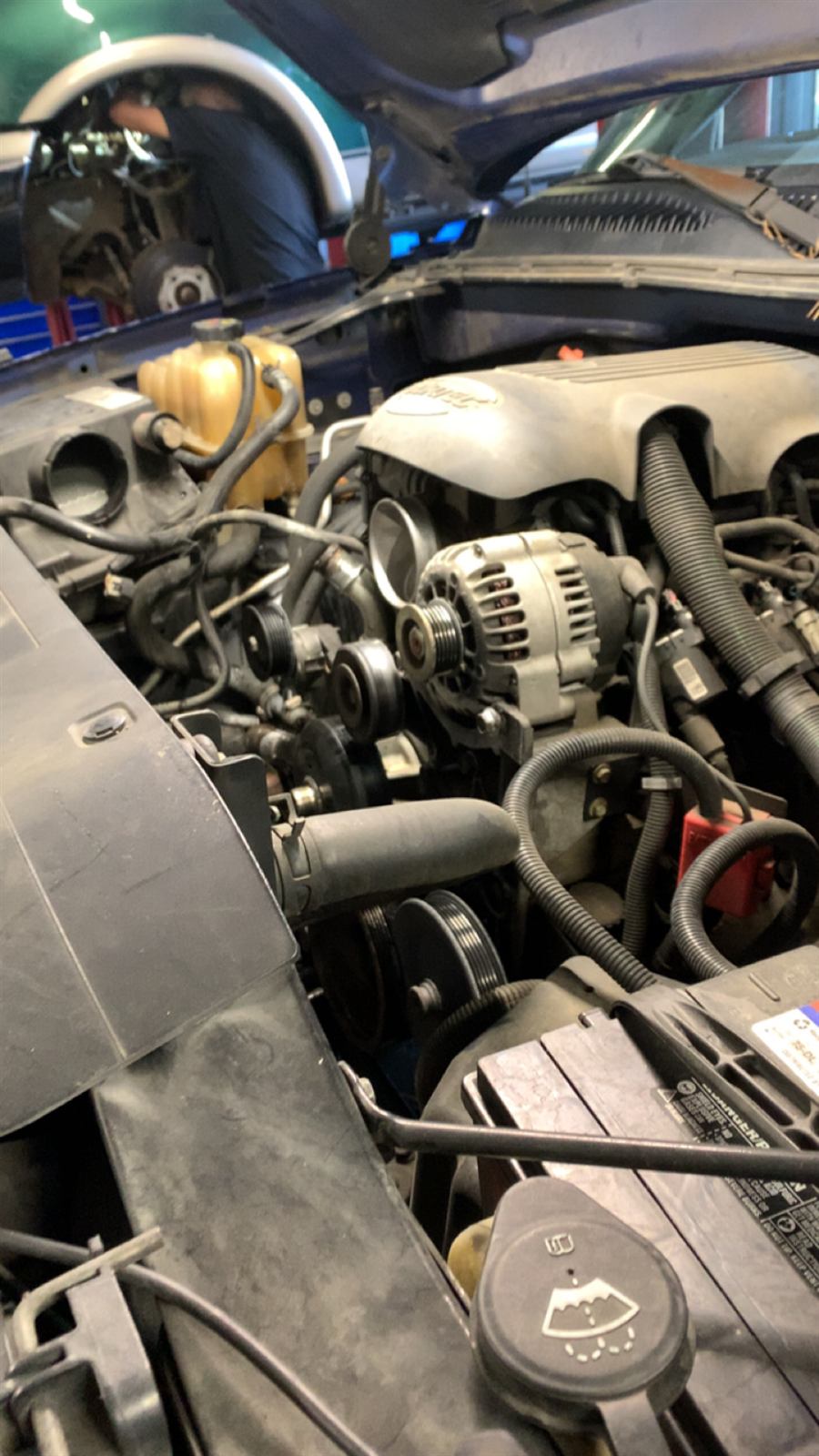 Silverado engine bay with the alternator, pulleys and belt in view